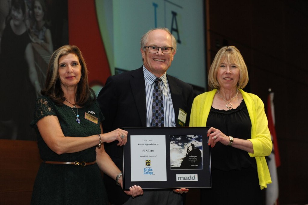 Alan Farrer, accepts award on behalf of PIA Law