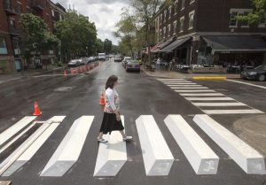 lady crossing 3d crosswalk in montreal